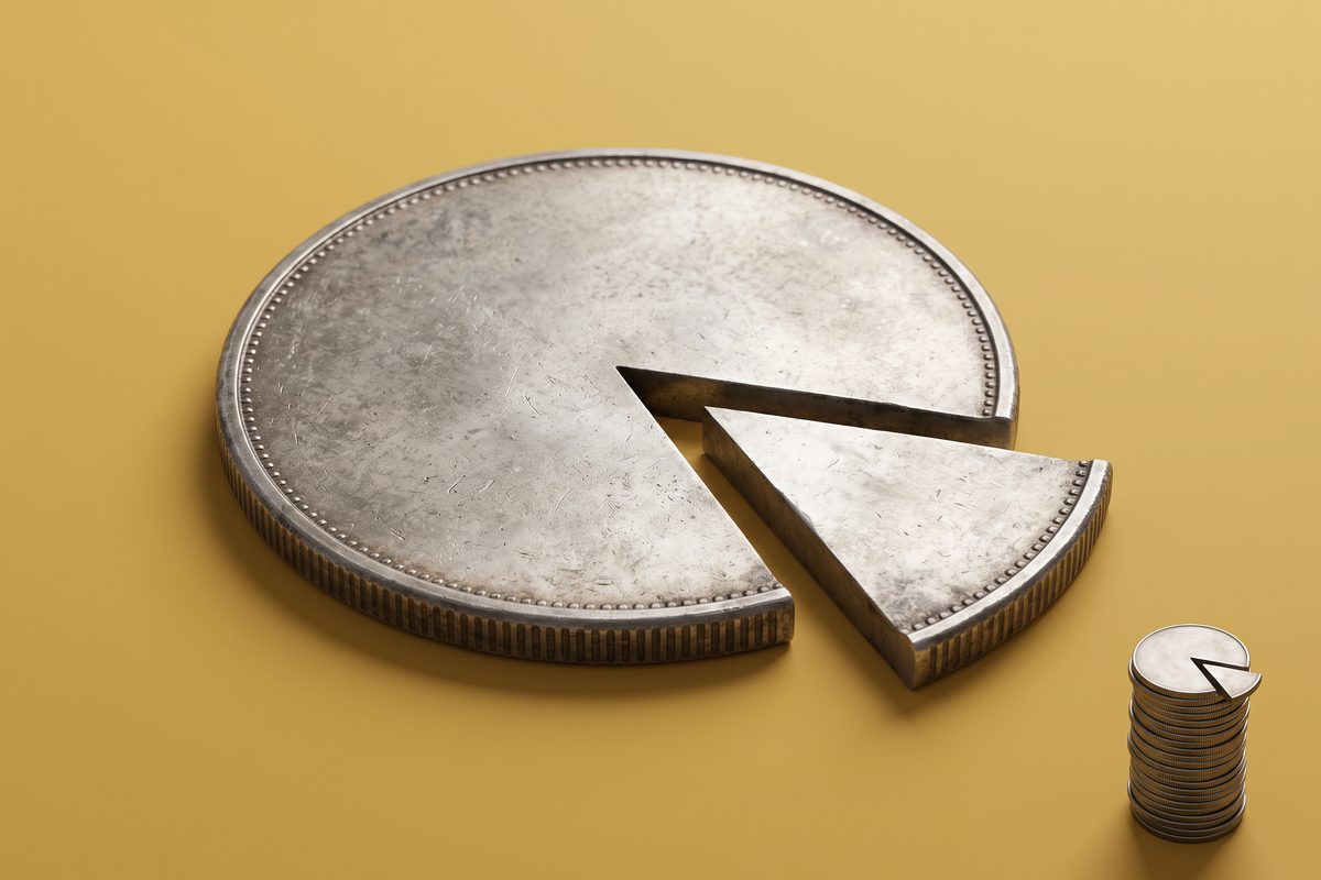 A single coin with a large wedge cut out next to a tall coin stack missing only a sliver, showing how a fixed fee hits small sales